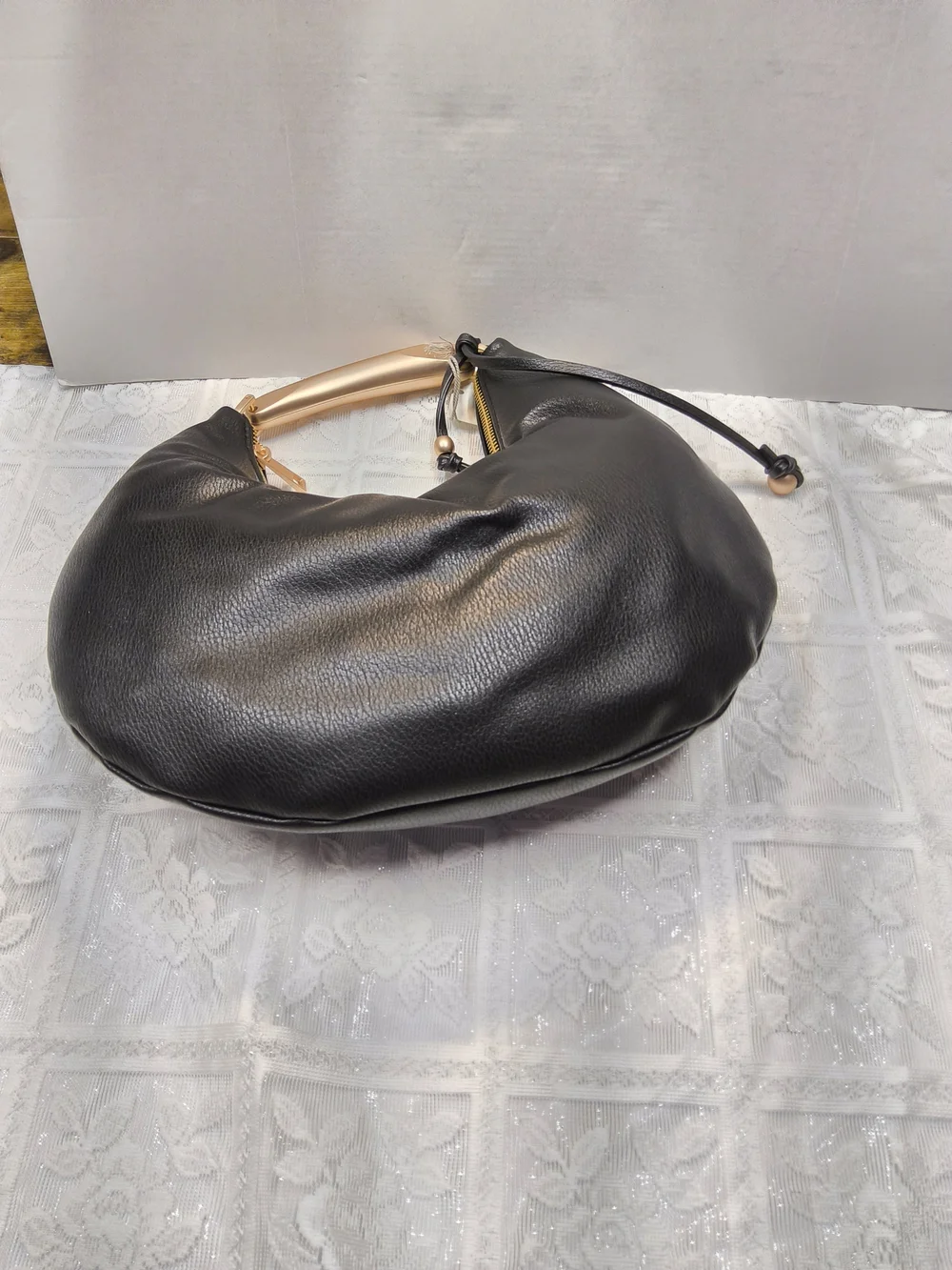 A New Day Crescent Handle Bag in Black with Gold Accent